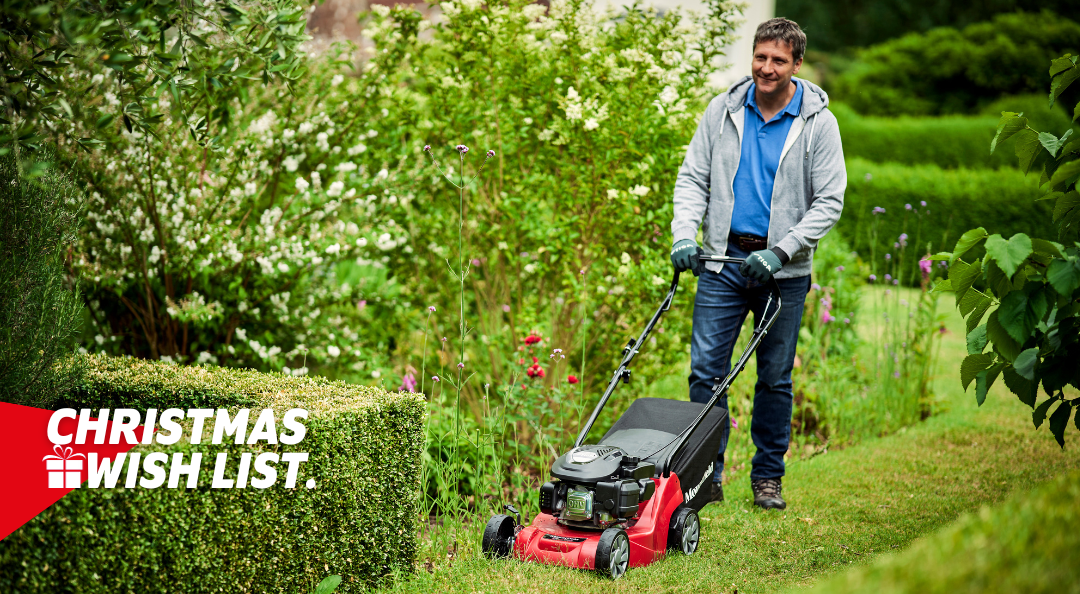 man mowing lawn with mountfield lawnmower